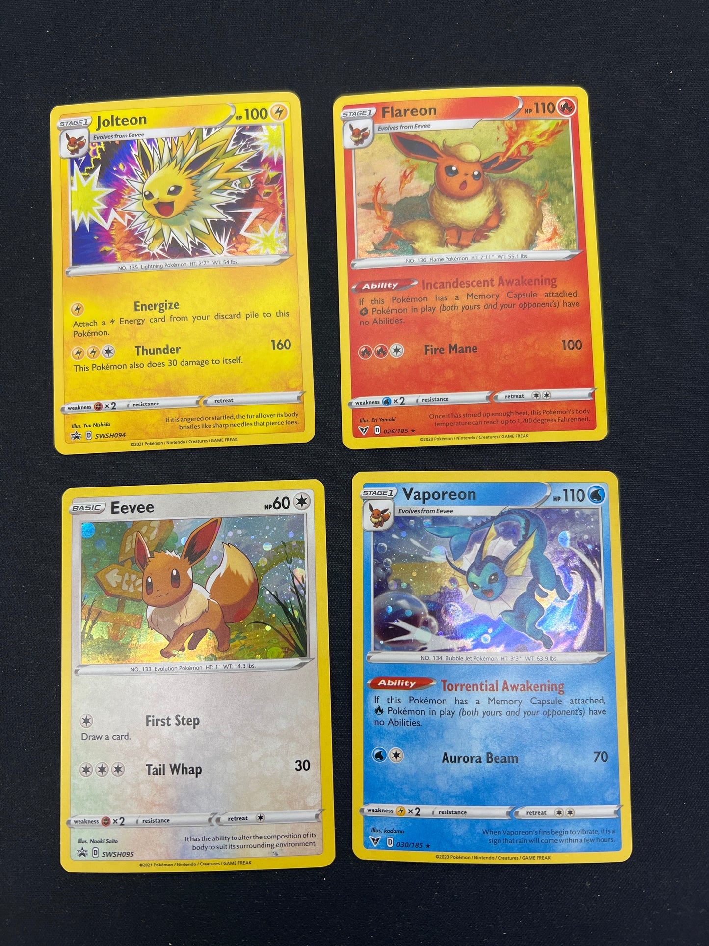 Auction Lot 120: Pokemon Cards Lot of 4 Assorted Eeveelutions Cosmo Holo SWSH Conditions Vary