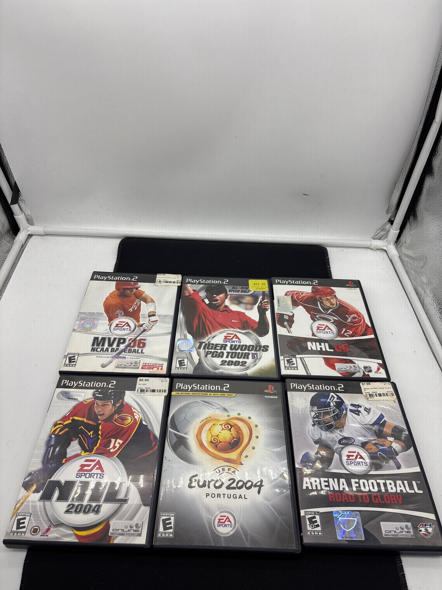 Auction Lot 113: Playstation 2 Video Game Lot of 6 NHL 04 08 Arena Football Road to Glory Tiger Woods PGA Tour 2002 NCAA Baseball MVP 06 Euro 2004