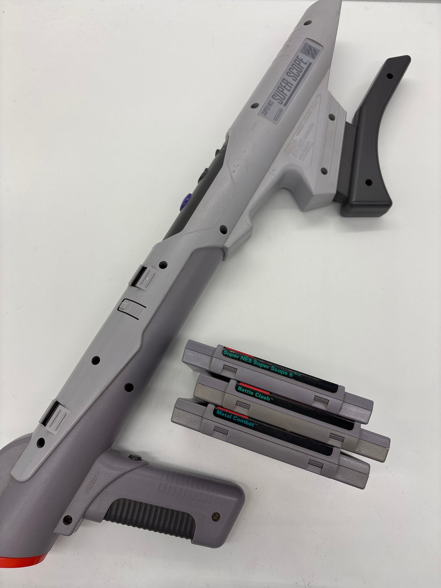 Auction Lot 142: Nintendo SNES Super Scope (No Transmitter) with Loose Video Game Lot