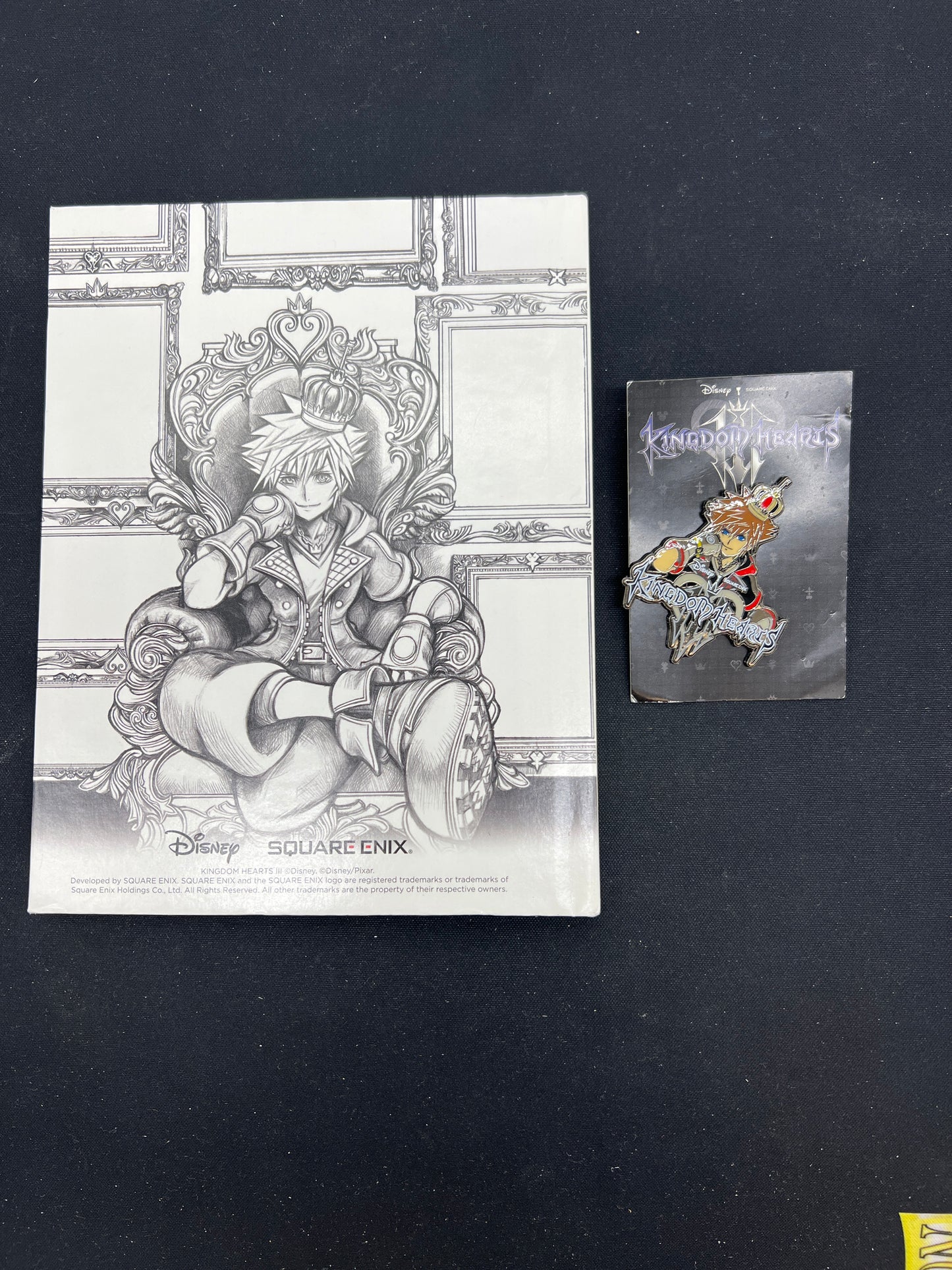 Auction Lot 266: Kingdom Hearts Assorted Keychain and Book Collectible