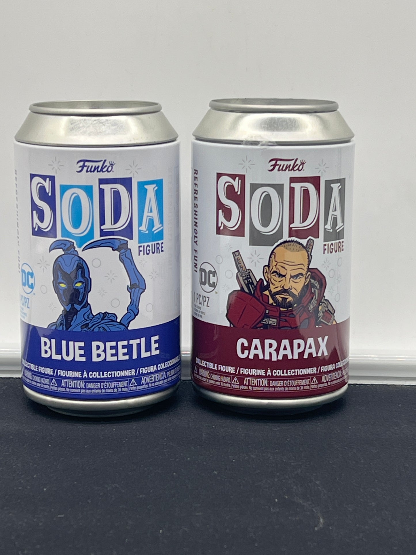 Auction Lot 136: Funko Soda Lot of 2 Blue Beetle & Carapax