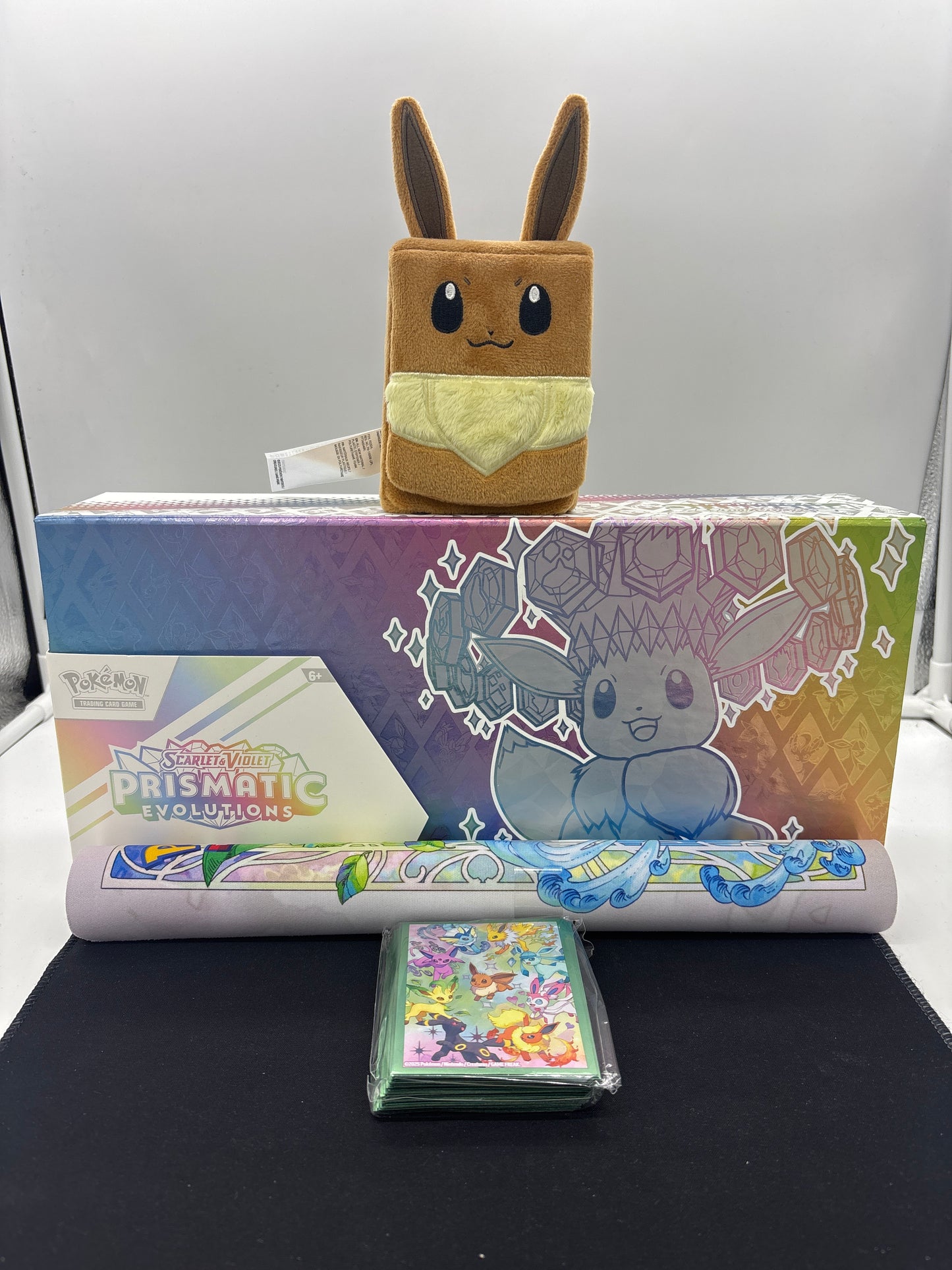 Auction Lot 2: Pokemon SV Prismatic Evolutions SPC (EMPTY) With Deck Box, Sleeves & Playmat