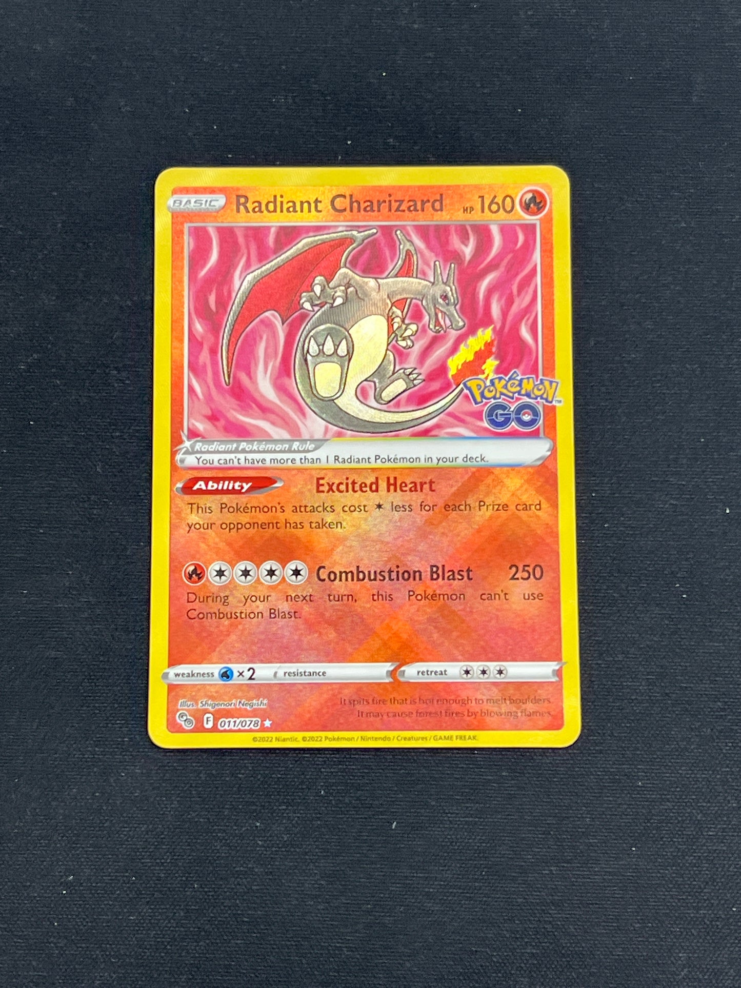 Auction Lot 381: Pokemon Cards Radiant Charizard Pokemon Go Stamped Condition Vary