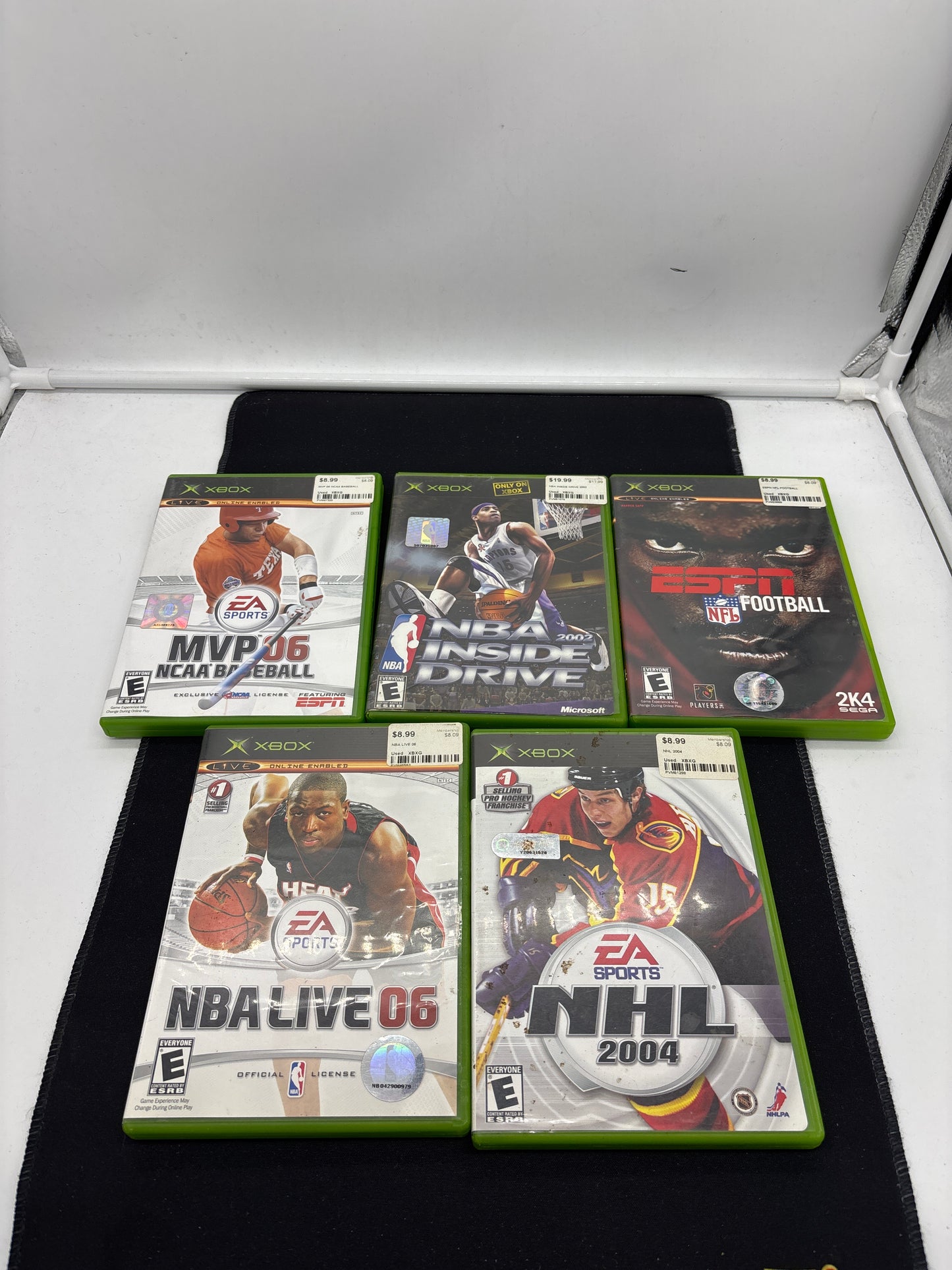Auction Lot 110: XBOX Video Game Lot of 5 NCAA Baseball MVP 06 NHL 2004 NBA Live 06 ESPN NFL Football NBA Inside Drive 2002
