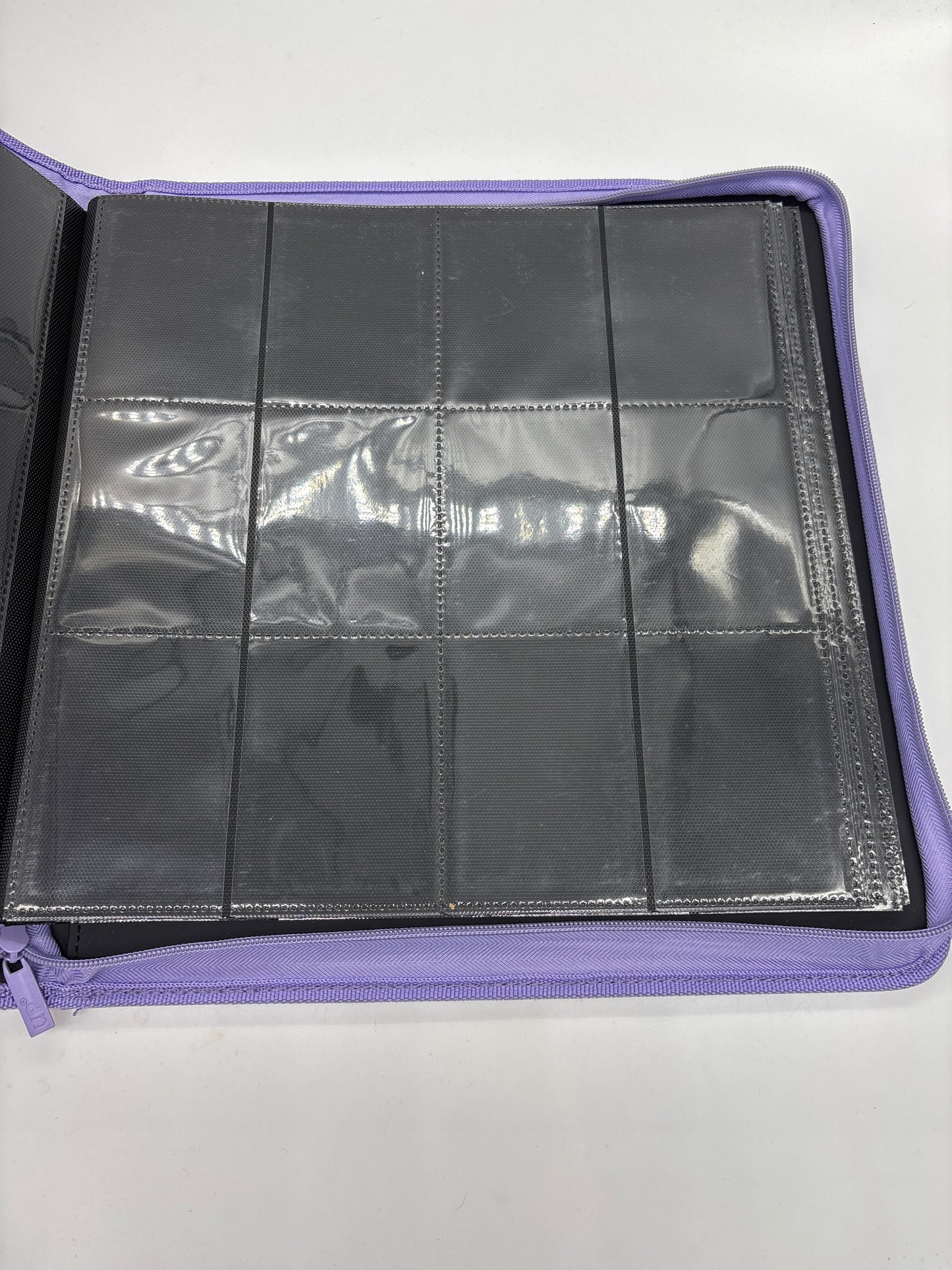 Auction Lot 99: UltraPro Light Purple 16 Pocket Zipper TCG Binder Lightly Used