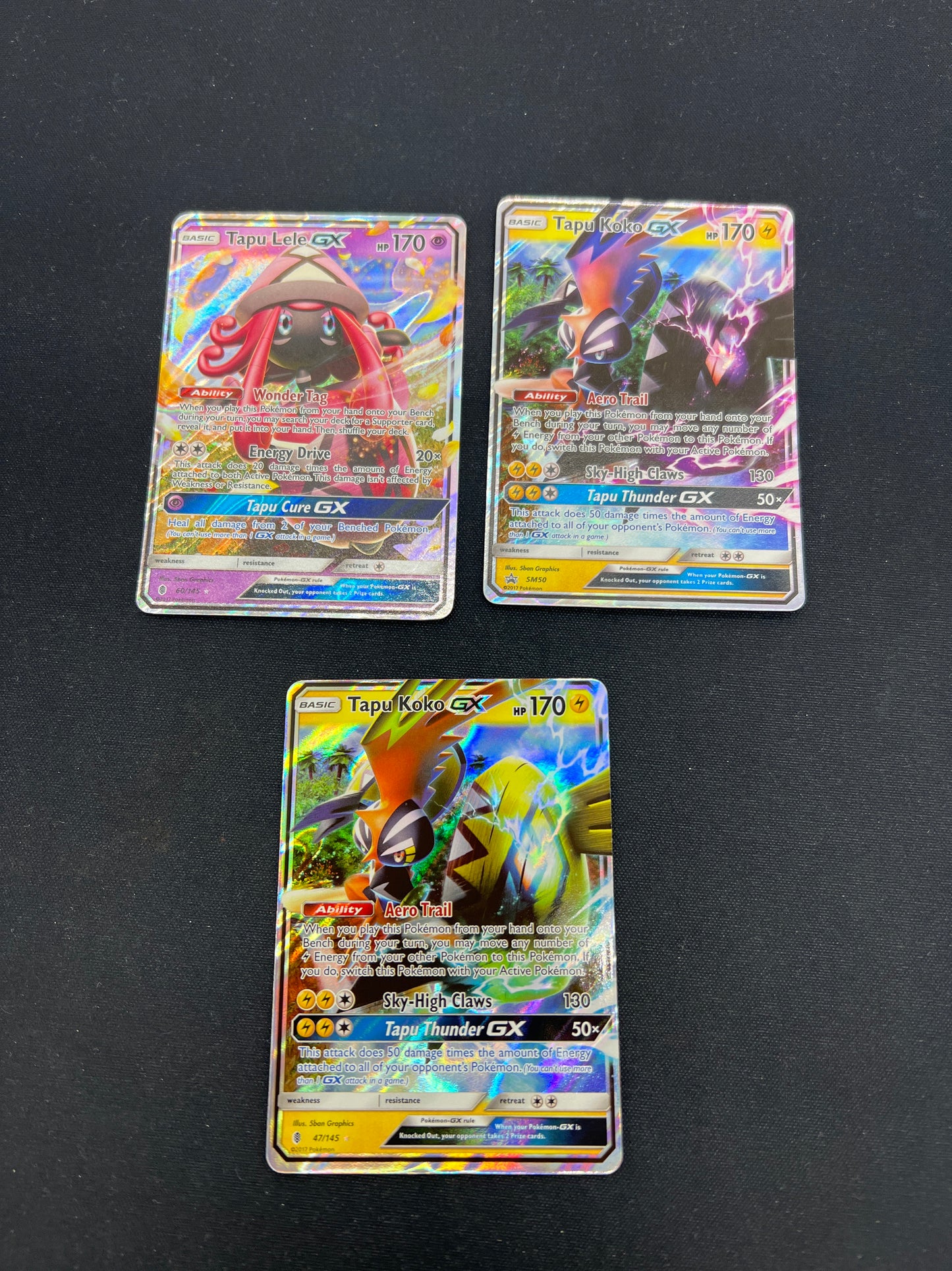 Auction Lot 219: Pokemon Cards Assorted Lot of 3 GX Full Arts Tapu Koko Tapu Lele Conditions Vary