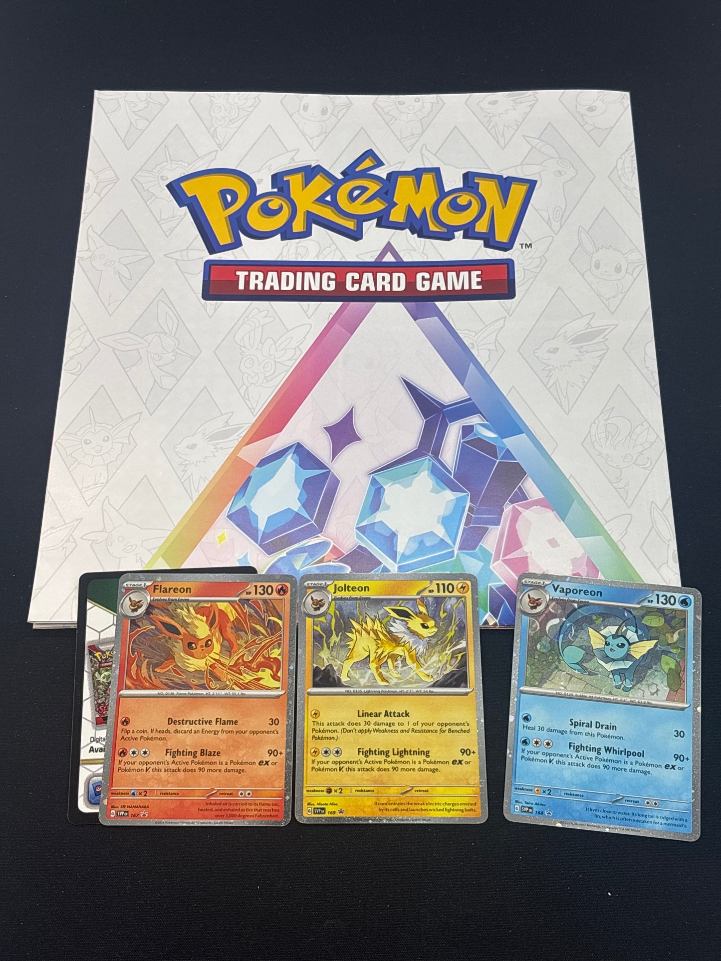 Auction Lot 63: Pokemon Prismatic Evolutions Poster & 3 Promo Card Lot Conditions Vary