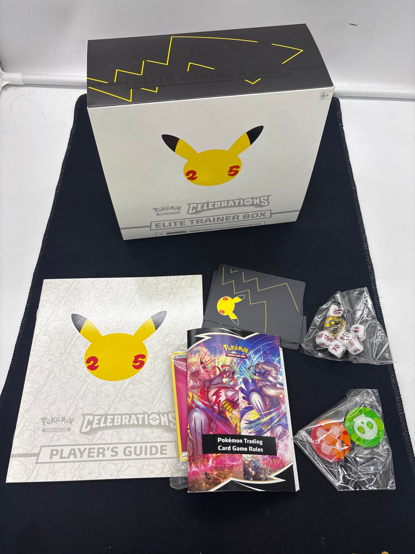 Auction Lot 215: Pokemon Celebrations  ETB Empty Box With Accessories