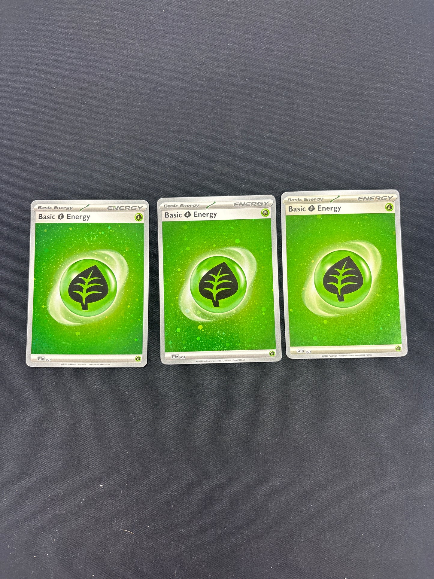 Auction Lot 252: Pokemon Grass Holo Energy Card Lot 2 Conditions Vary