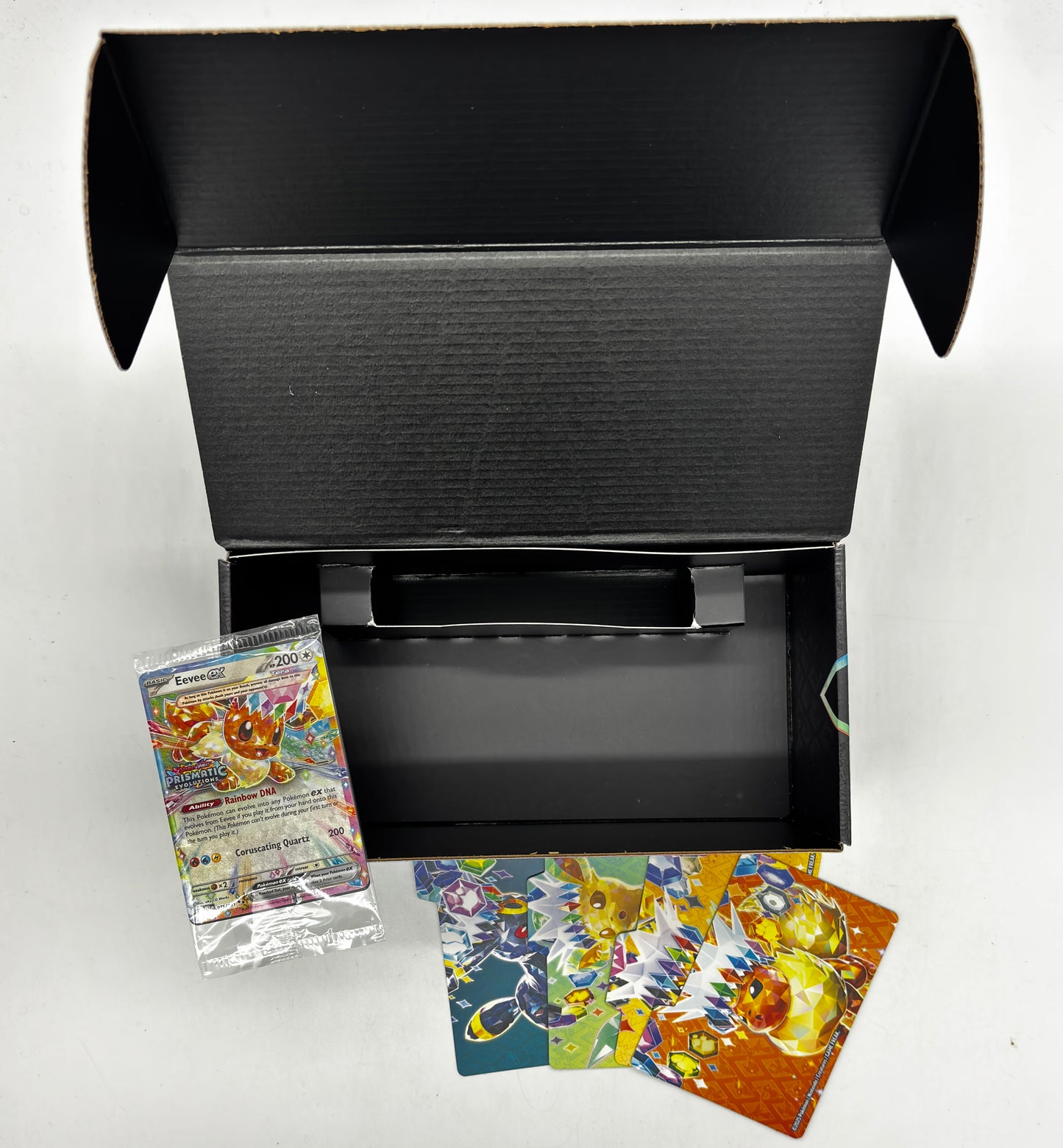 Auction Lot 110: Pokemon Prismatic Evolutions Surprise Box With Stamped Eevee EX and Dividers